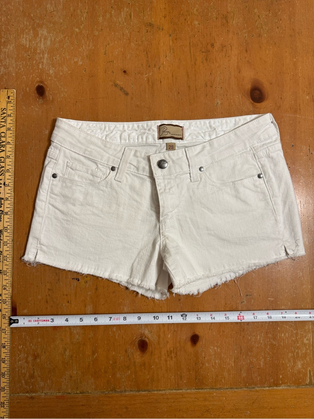 PAIGE White Denim Frayed Hem Cutoff Shorts